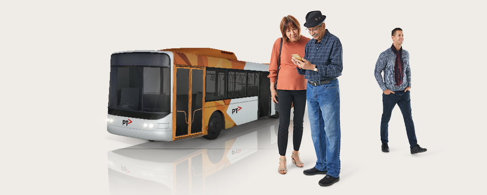 Man and woman checking phone in front of bus