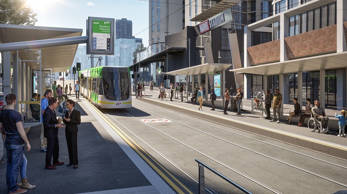 Design showing upgraded Docklands Stadium (D1) tram stop featuring raised platforms for level boarding with low-floor trams, new shelters, seating, improved lighting and passenger information displays. Passengers also shown using the tram stop. 